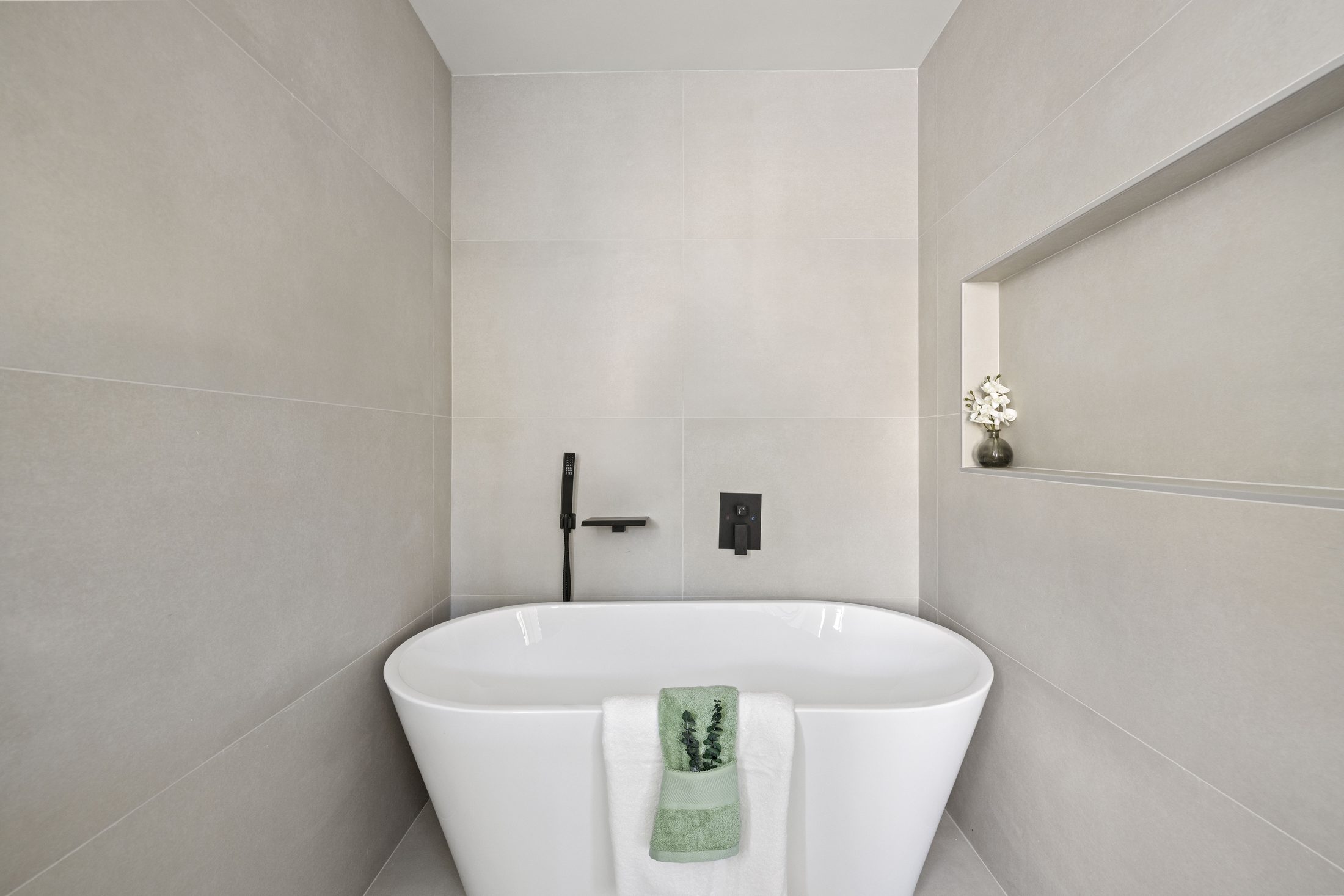 Freestanding soaking tub in the primary bath