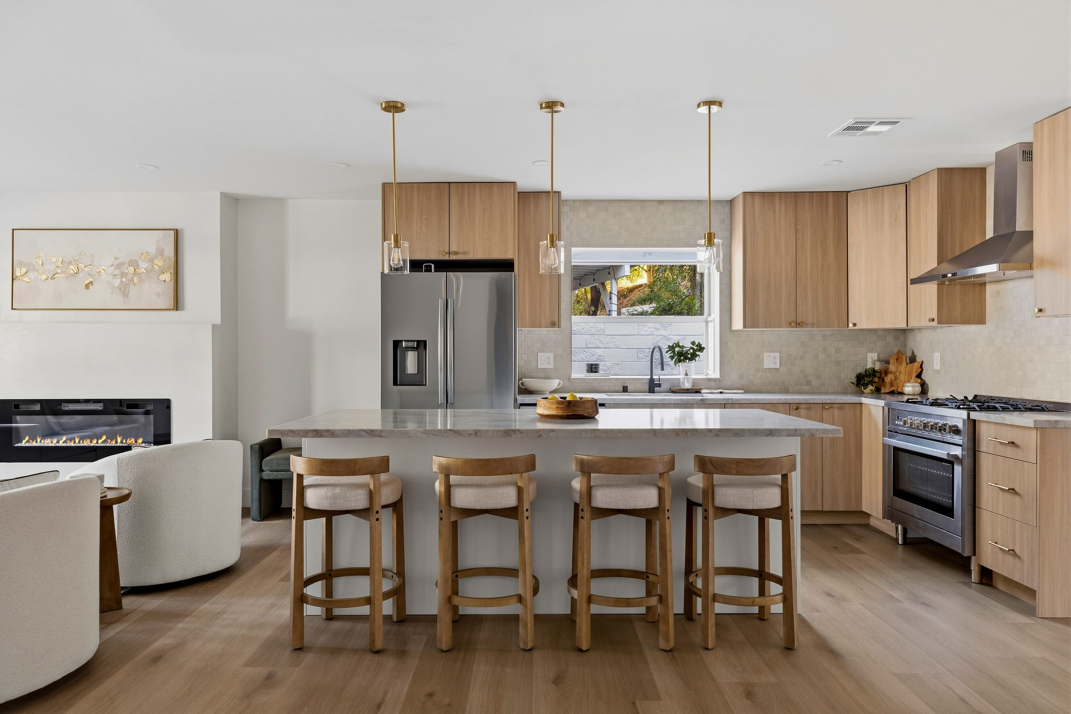 New kitchen with Taj Mahal quartz counters and stainless appliances
