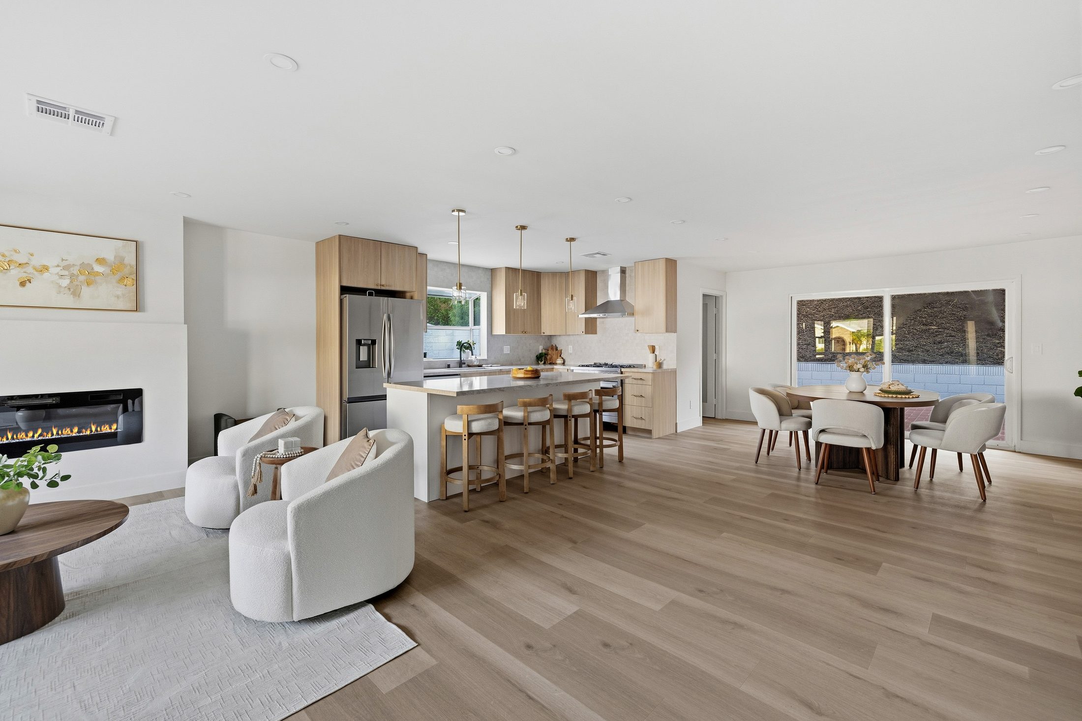 Overview of the connected great room, kitchen and dining spaces
